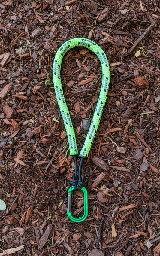 Neck tether for ascending and descending climbing systems. 