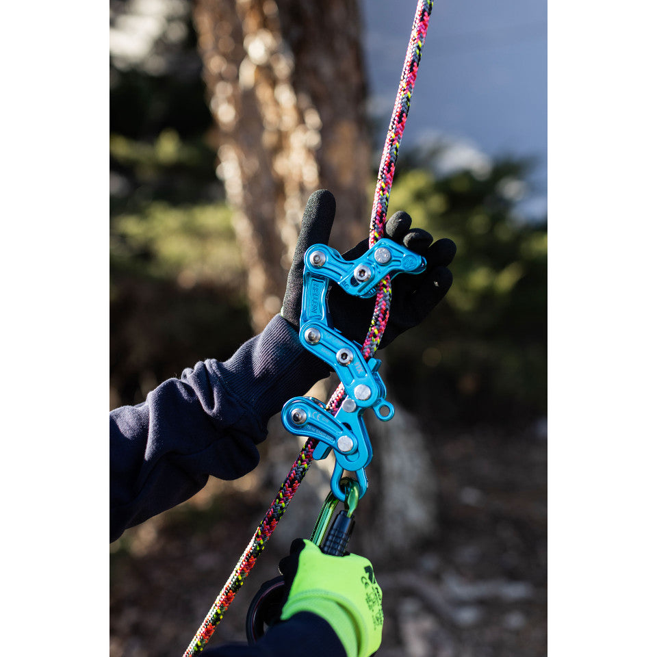 A limited edition teal Notch Rope Runner Pro work positioning device for climbing, showing its multiple components and sleek design.